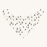 The Lassig organic cotton bandana dribble bib, in white with little grey triangles printed all over. It has white popper fastenings. 