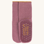 The Lassig organic cotton baby and toddler anti-slip grippy socks in dark pink magenta.