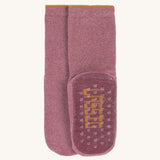 The Lassig organic cotton baby and toddler anti-slip grippy socks in dark pink magenta.