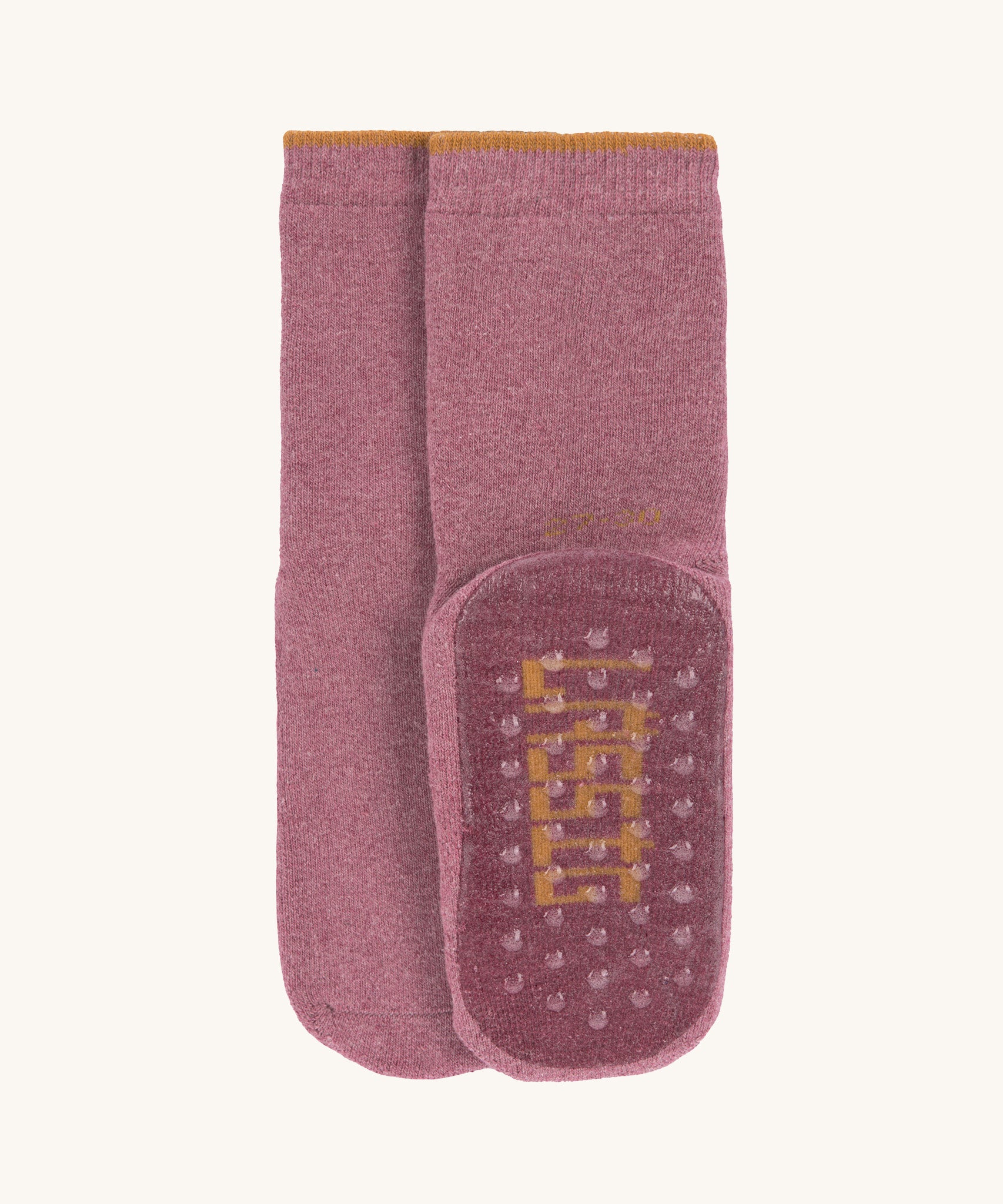 The Lassig organic cotton baby and toddler anti-slip grippy socks in dark pink magenta.