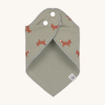 The Lassig Little Fox print organic cotton bandana bib, wrapped around and fastened with the popper fastenings. 