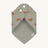The Lassig Little Fox print organic cotton bandana bib, wrapped around and fastened with the popper fastenings. 