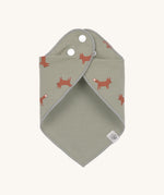 The Lassig Little Fox print organic cotton bandana bib, wrapped around and fastened with the popper fastenings. 