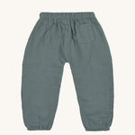 The back of the Lassig organic cotton muslin trousers for babies and toddler, in petrol green. 