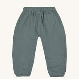 The back of the Lassig organic cotton muslin trousers for babies and toddler, in petrol green. 