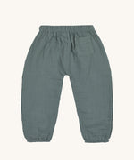The back of the Lassig organic cotton muslin trousers for babies and toddler, in petrol green. 