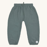 The Lassig organic muslin baby pants in petrol green. 