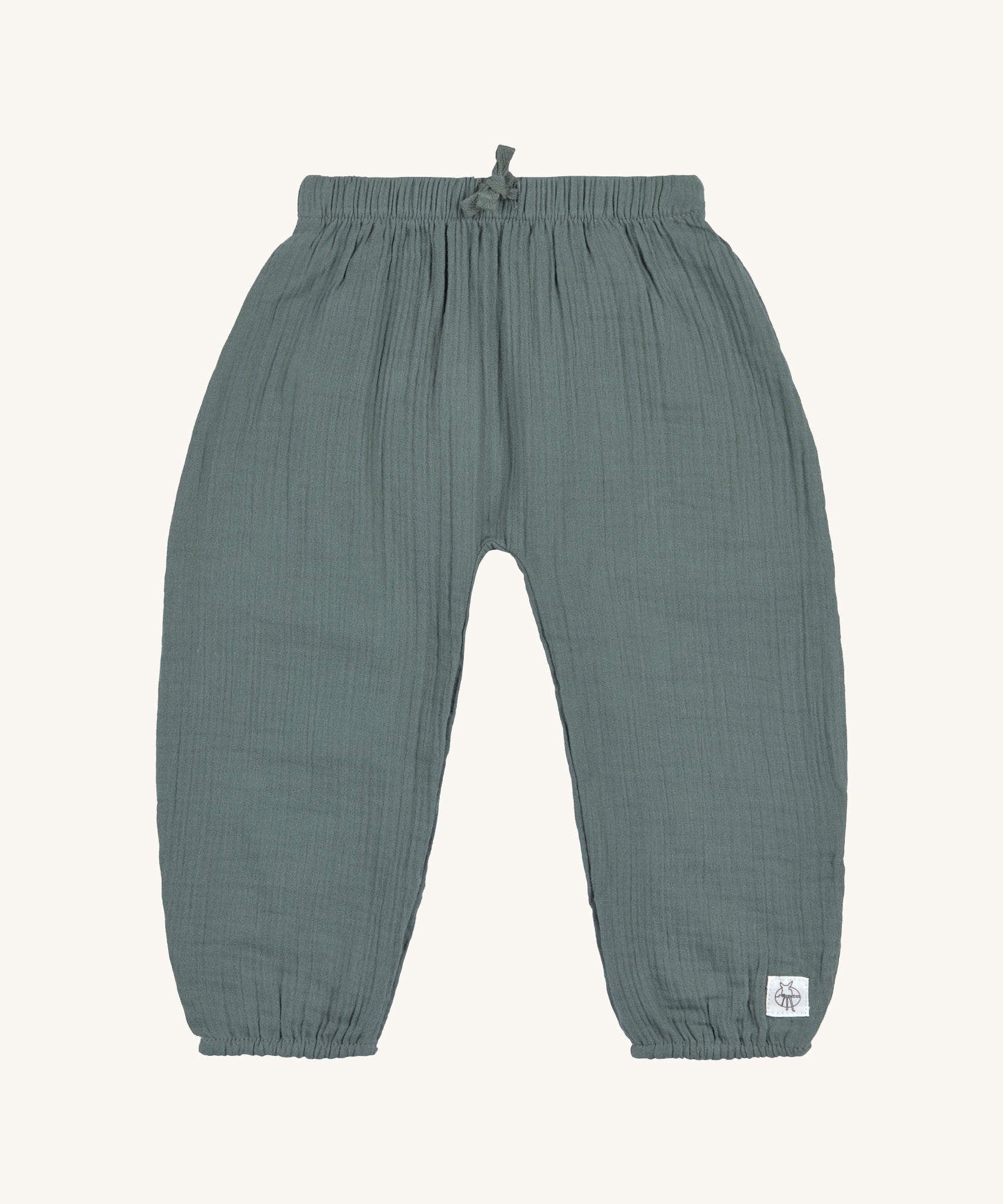 The Lassig organic muslin baby pants in petrol green. 