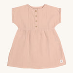 The Lassig organic cotton muslin dress for babies and toddlers in a pretty powder pink colour.