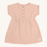 The Lassig organic cotton muslin dress for babies and toddlers in a pretty powder pink colour.