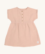 The Lassig organic cotton muslin dress for babies and toddlers in a pretty powder pink colour.