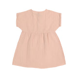 The back of the Lassig organic cotton muslin dress for babies and toddlers in a pretty powder pink colour.