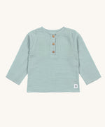 The Lassig organic cotton muslin long sleeved shirt for babies and toddlers, in a silver grey with three little brown buttons.