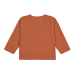 The back of the Lassig organic cotton muslin shirt for babies and toddlers, in a bright orange rust colour.