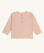 The Lassig organic cotton muslin long sleeved top for babies and toddlers, in a beautiful pale powder pink colour with little buttons.