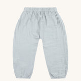 The back of the Lassig organic cotton muslin baby trousers, in powder blue. 