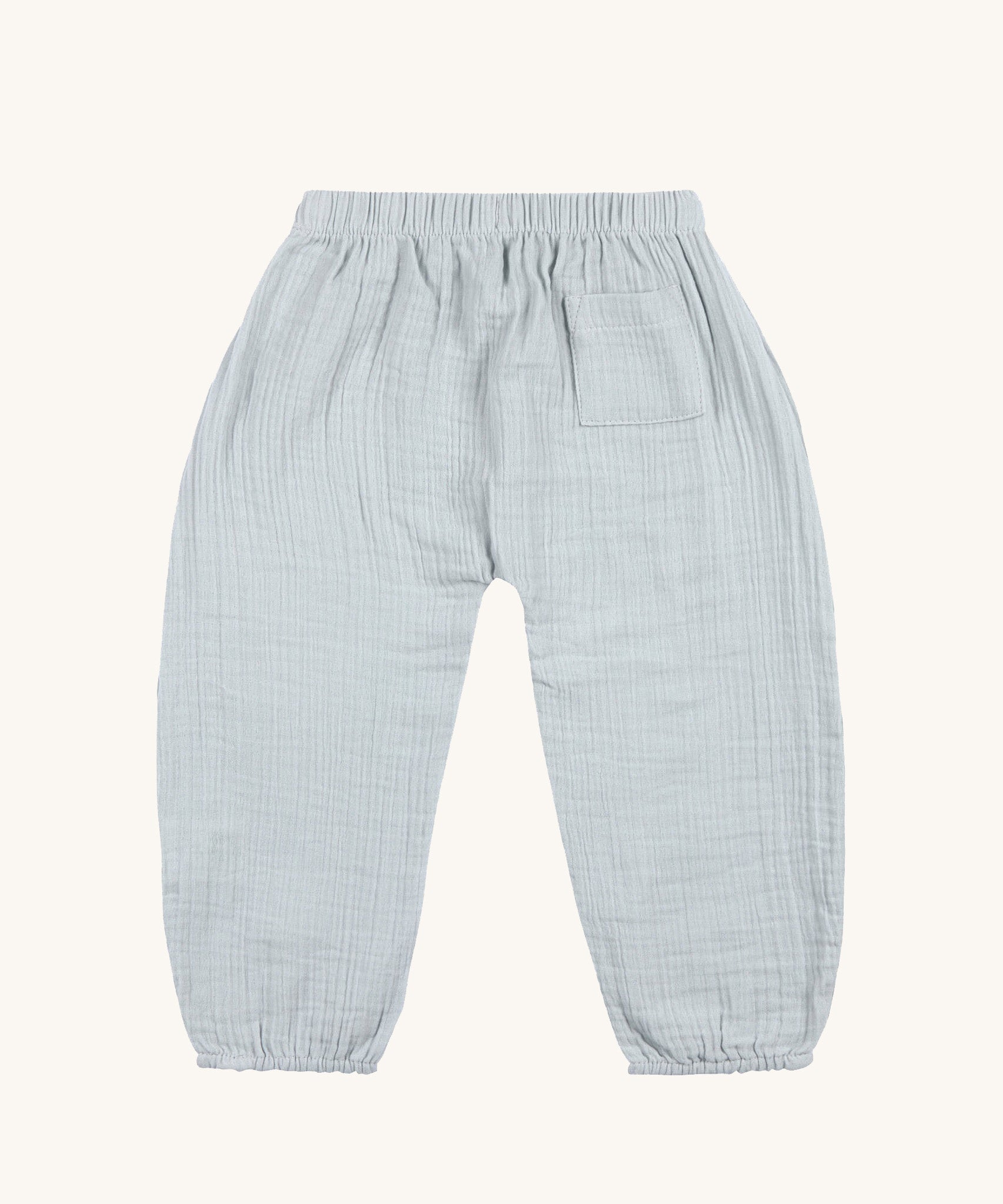 The back of the Lassig organic cotton muslin baby trousers, in powder blue. 