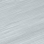 A closeup of the lovely organic cotton muslin fabric, in powder blue. 