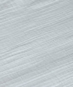 A closeup of the lovely organic cotton muslin fabric, in powder blue. 