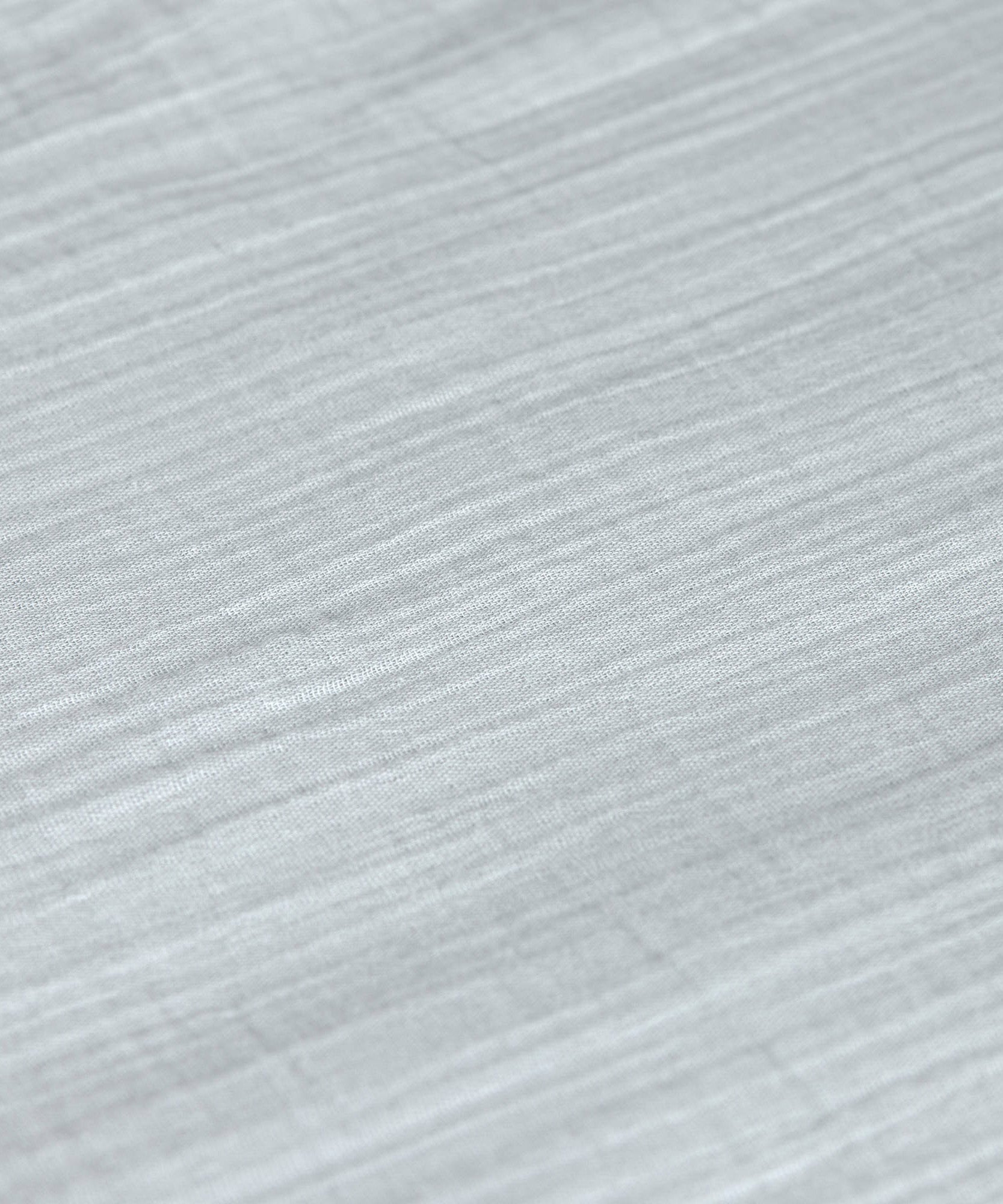 A closeup of the lovely organic cotton muslin fabric, in powder blue. 