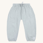 The Lassig organic cotton muslin baby and toddler trousers, in a light powder blue colour. 