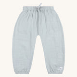 The Lassig organic cotton muslin baby and toddler trousers, in a light powder blue colour. 