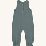 The Lassig organic cotton muslin jumpsuit in a petrol green colour.