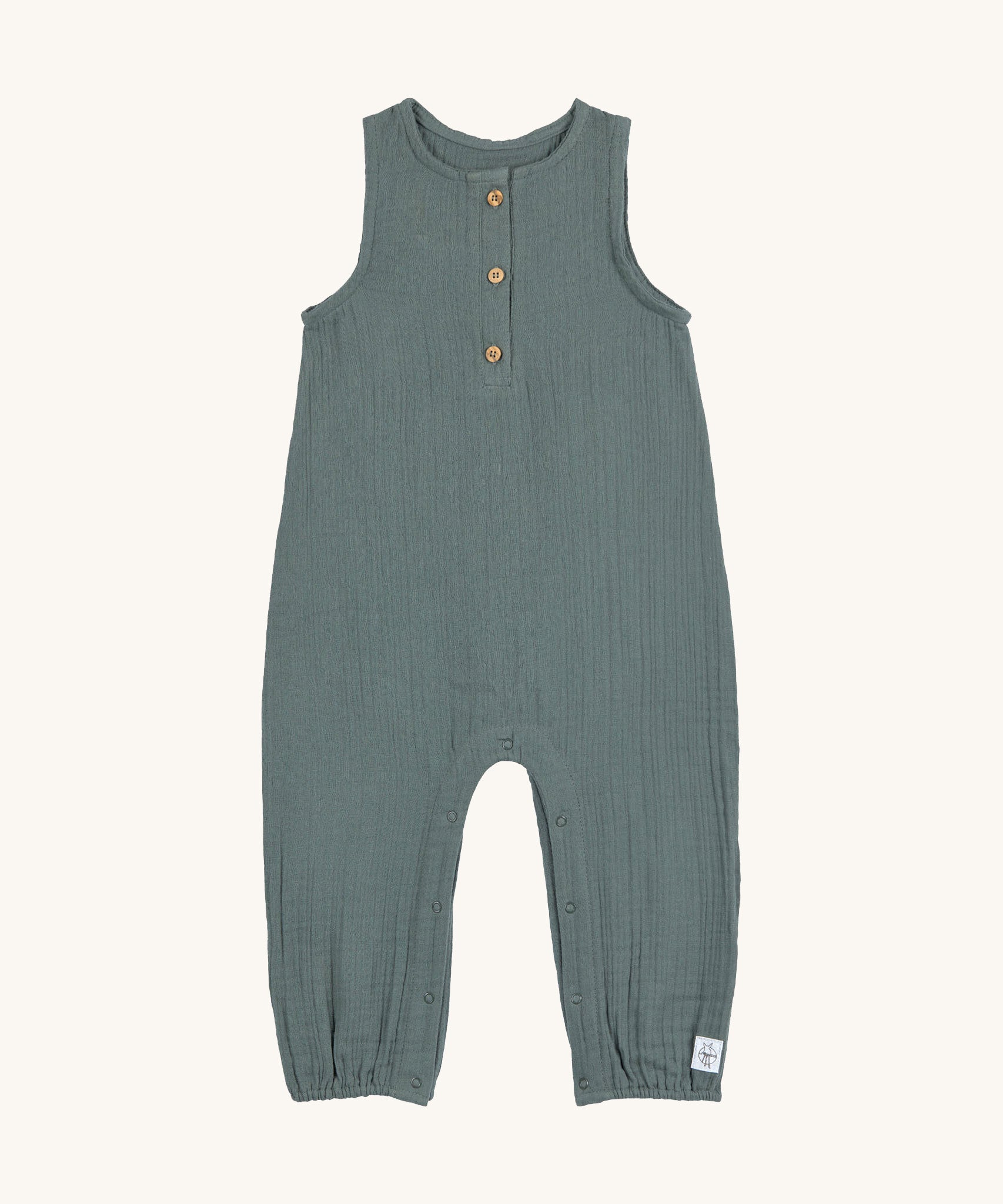 The Lassig organic cotton muslin jumpsuit in a petrol green colour.