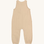 The back of the Lassig organic cotton muslin baby and toddler jumpsuit in a natural cream colour.