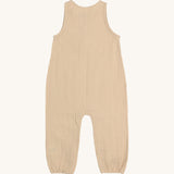 The back of the Lassig organic cotton muslin baby and toddler jumpsuit in a natural cream colour.