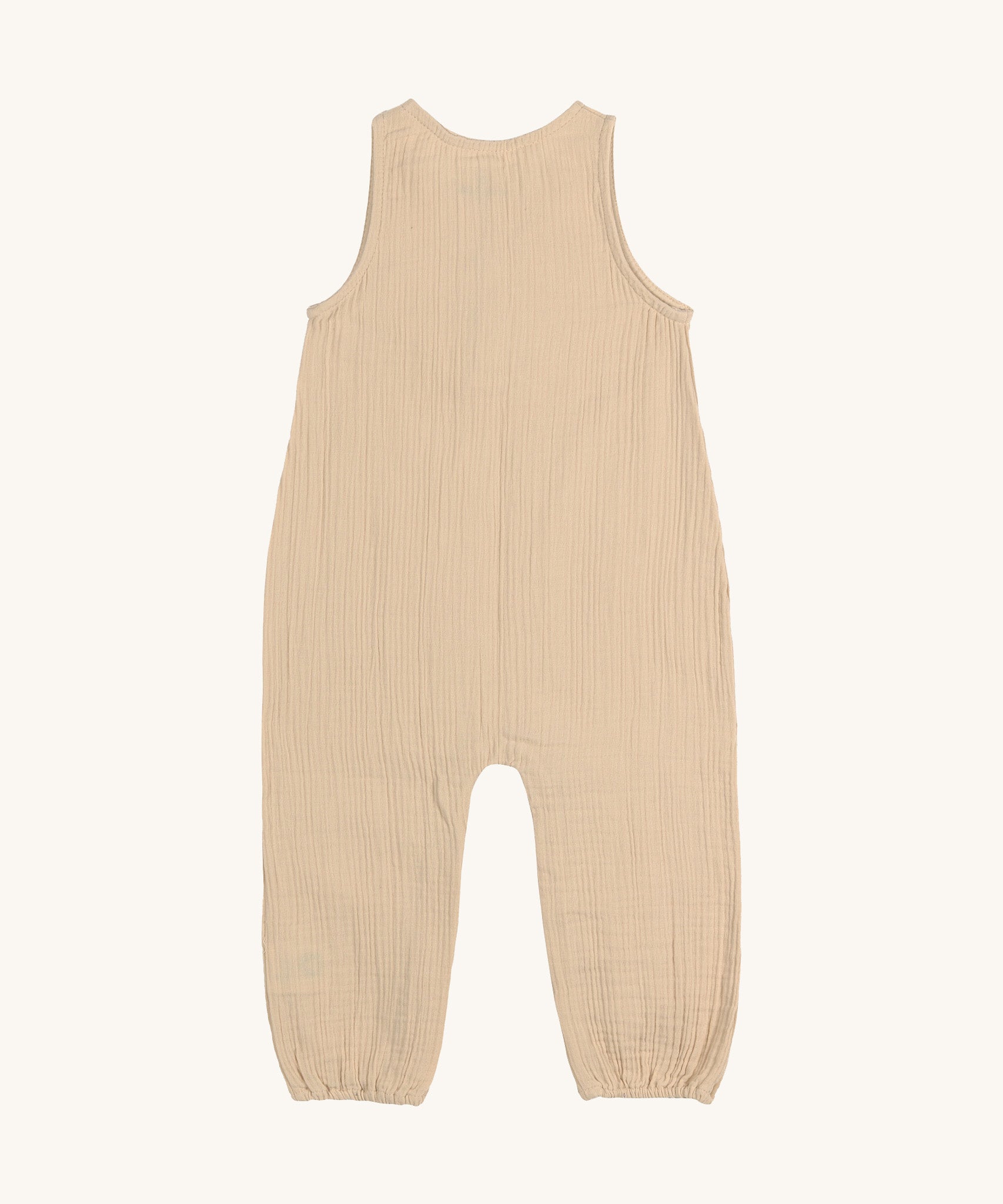 The back of the Lassig organic cotton muslin baby and toddler jumpsuit in a natural cream colour.