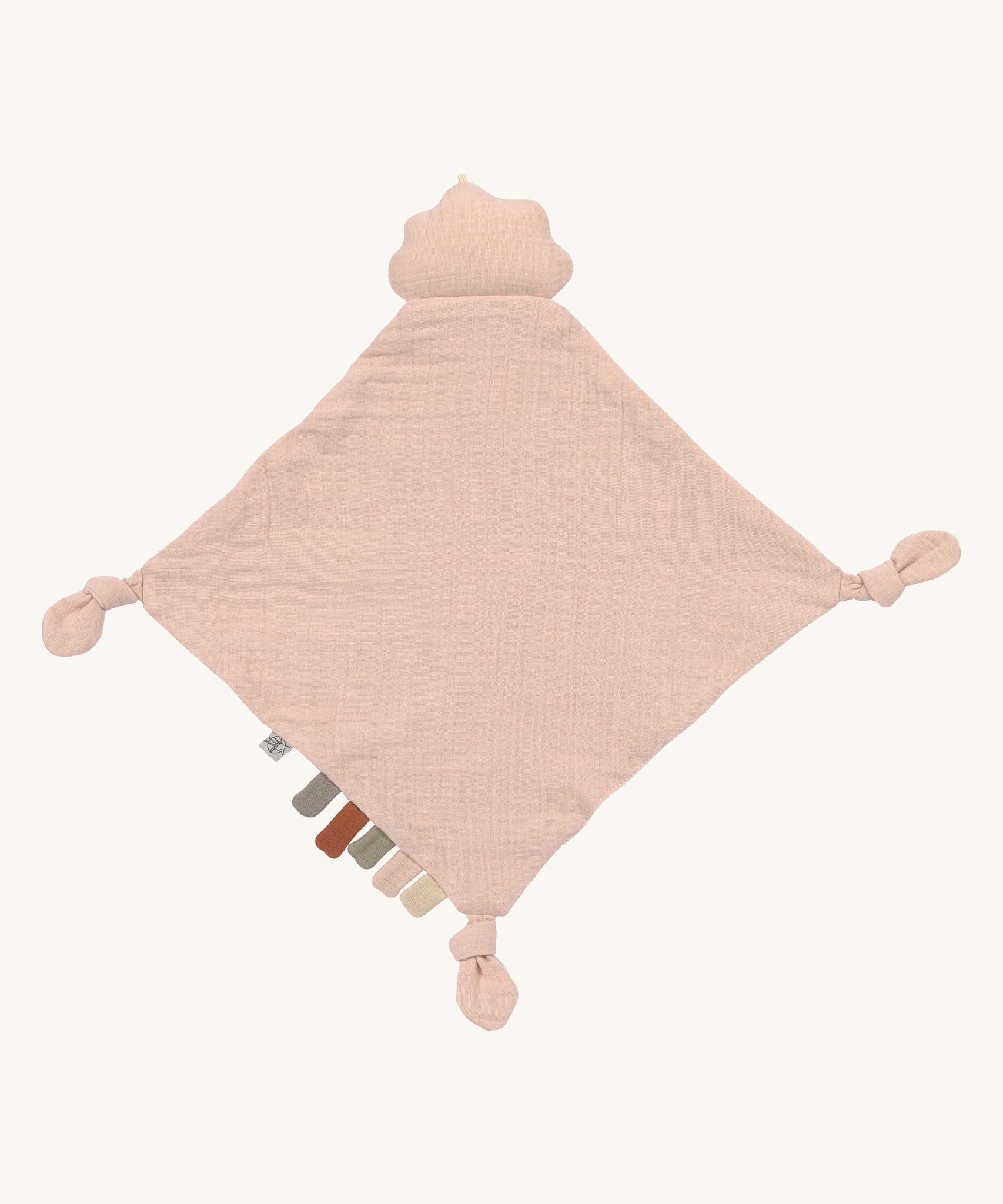 The Lassig organic cotton baby comforter in light pink, with a pink cloud attached.