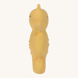 Front view of the Lassig natural rubber bath toy, a yellow seahorse.