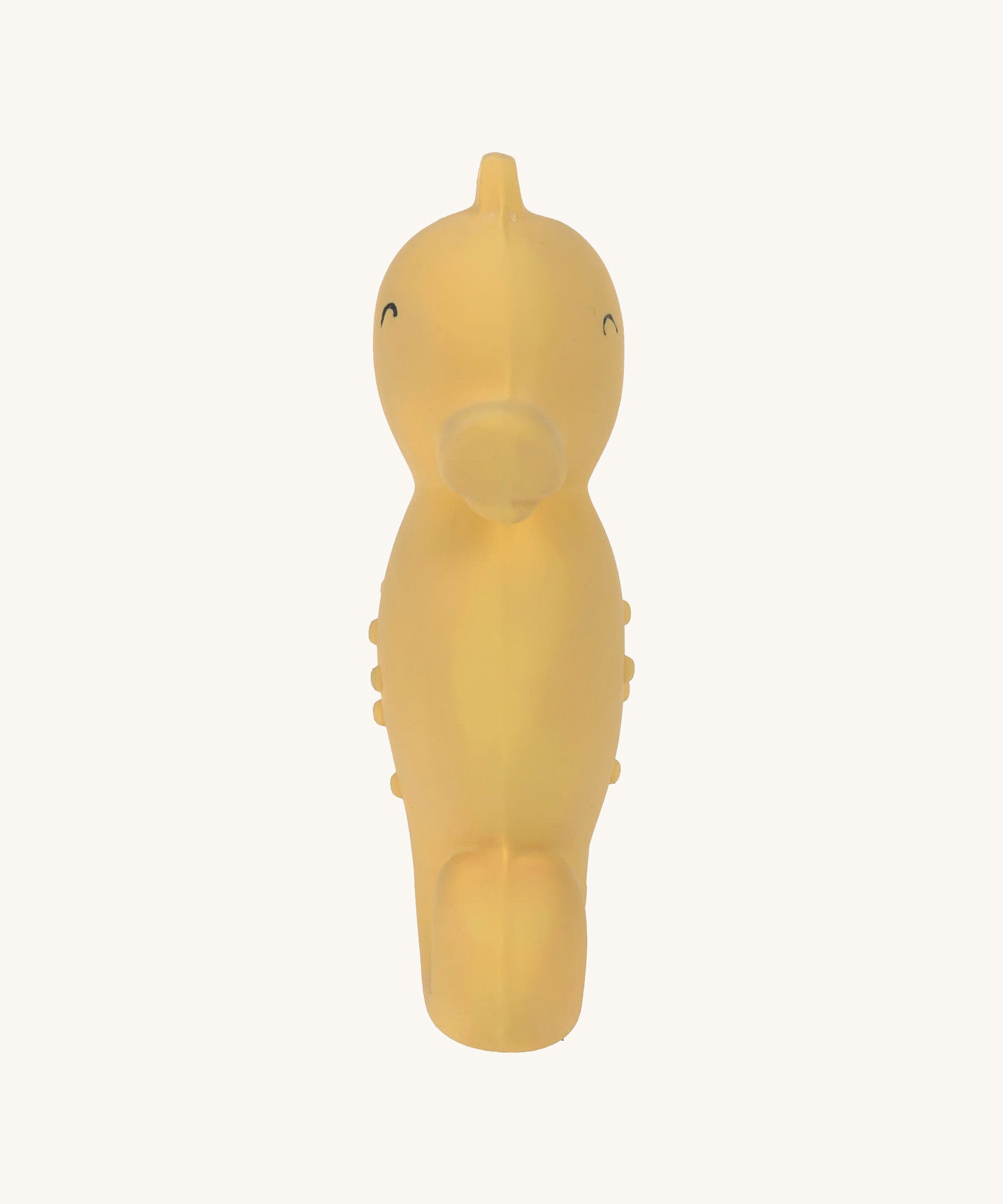 Front view of the Lassig natural rubber bath toy, a yellow seahorse.