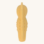 Back view of the Lassig natural rubber bath toy, a yellow seahorse.