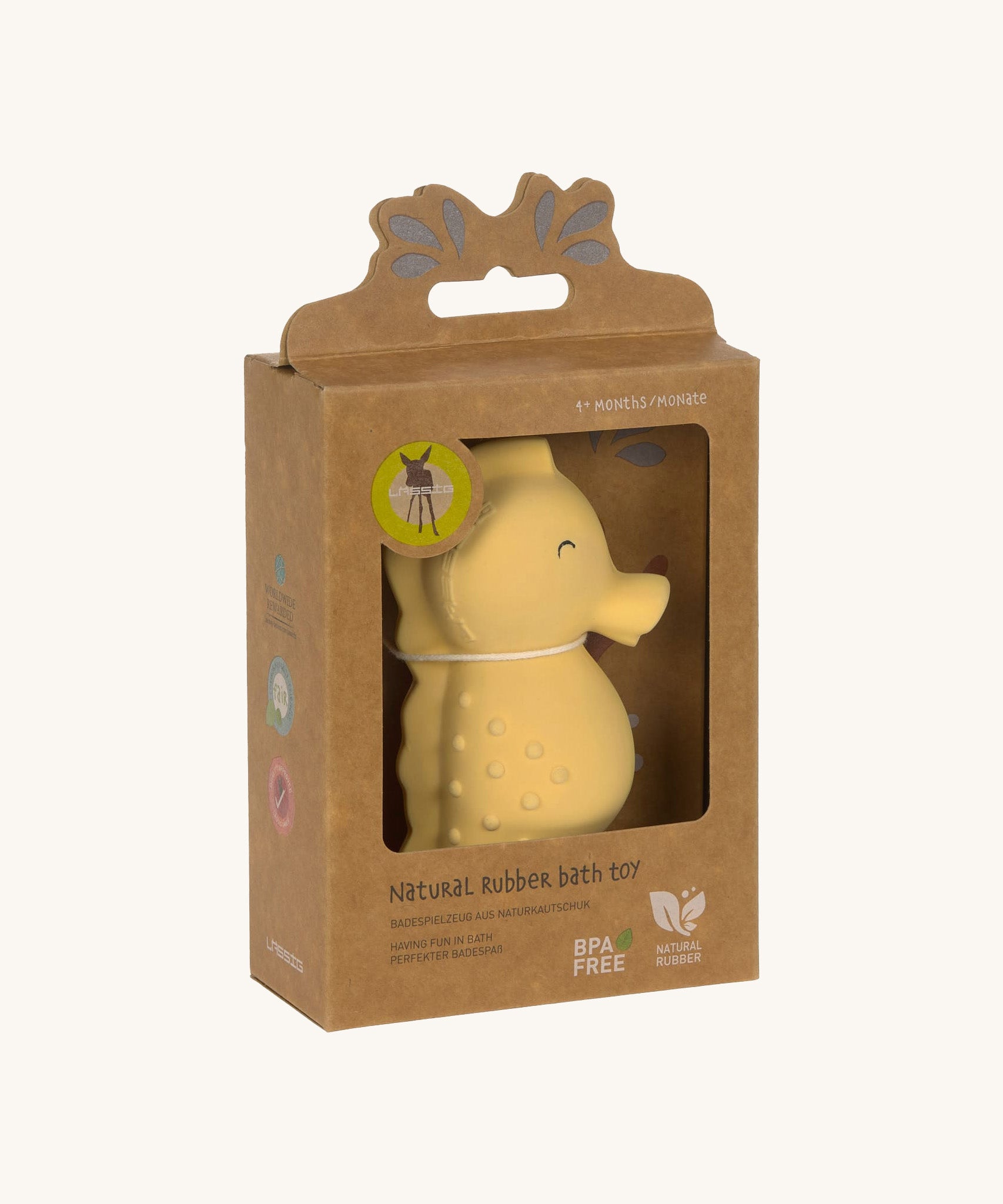 The Lassig yellow seahorse natural rubber bath toy in its recyclable cardboard box. 