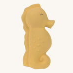 The Lassig yellow seahorse natural rubber bath toy.