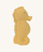 The Lassig yellow seahorse natural rubber bath toy.