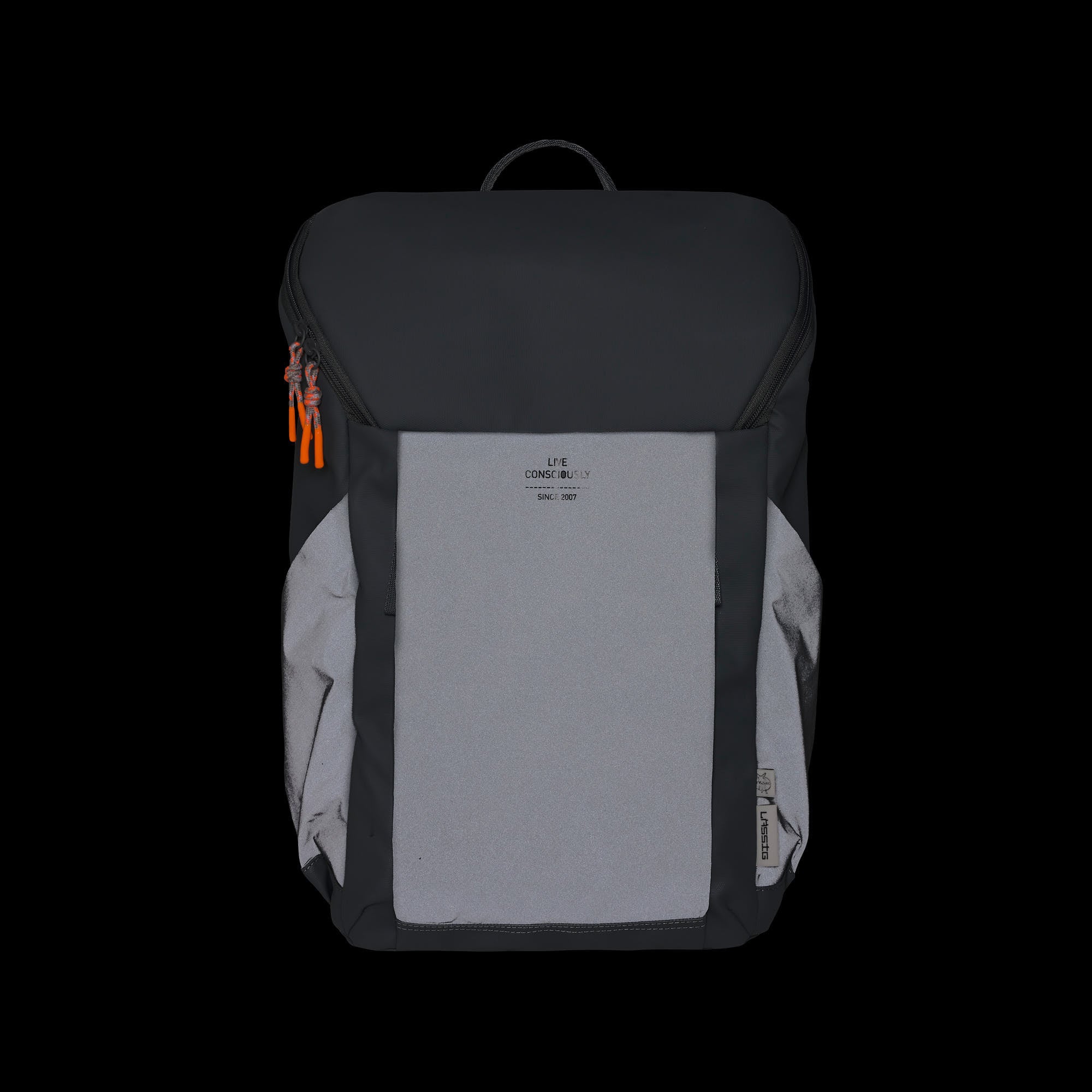 The Lassig Slender Up nappy change backpack in reflective anthracite, shown in a dark room to show the reflective material.