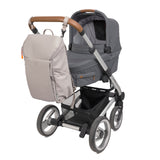 The Lassig Slender Up nappy change backpack in Taupe, attached to a pram with the included pram clips.