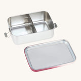 The Lassig Stainless Steel Lunchbox in a Unique Berry Rose colour shown with the lid taken off. This stainless steel lunch box has a removable divider.