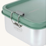 A close up of the clamp latch closure on the Lassig Stainless Steel Lunchbox with a Unique Olive Green colour lid. These stainless steel lunchboxes have a removable divider inside. 
