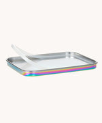 The lid of the Lassig Stainless Steel Lunchbox in a  Solid Bold Rainbow design showing the silicone seal. A stainless steel lunchbox with removable divider featuring an iridescent rainbow coloured lid. This lunchbox is part of a wide range of reusable items available at Babipur. 