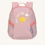 The Lassig tiny backpack for toddlers and little kids, in a light pink with a little cartoon sun of the front.