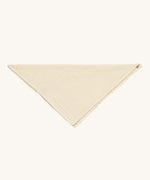 The Lassig organic cotton muslin bandana dribble bib, in a creamy Vanilla colour.