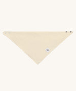 The Lassig organic cotton muslin bandana dribble bib, in a creamy Vanilla colour.