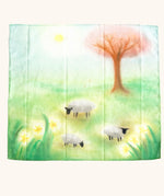 play cloth with a green spring meadow, sheep grazing, daffodils growing, a tree and sun shining. 