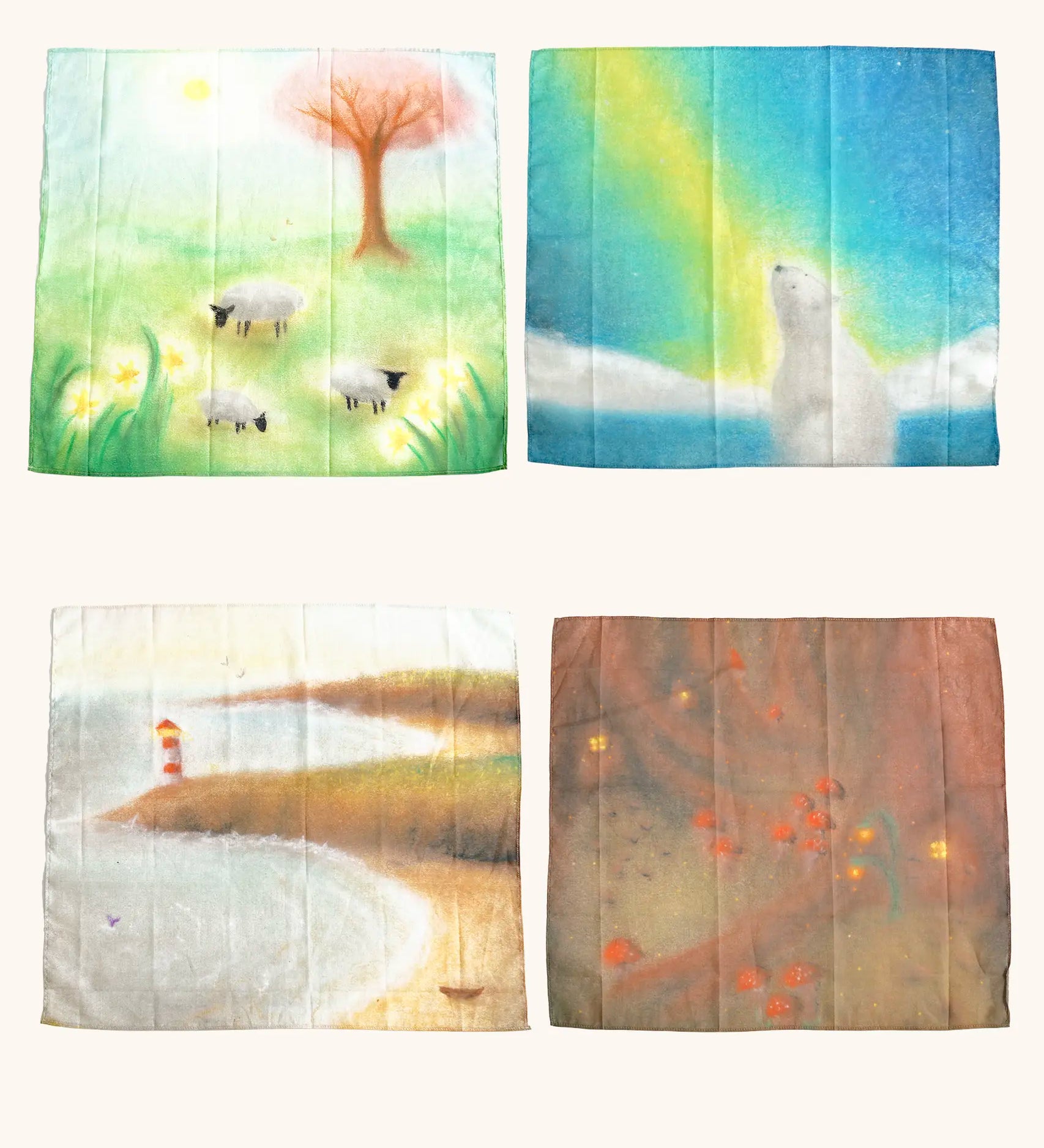 laura's play cotton seasonal set,  different play cloths laid out with artwork representing spring, summer autumn and winter