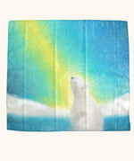 winter play cloth with a polar bear looking up at the northern lights from an icy landscape