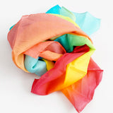 Laura's play cotton pastel rainbow gradient playcloth, made from 100% organic cotton ruffled up into a pile